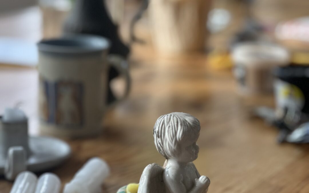Small statue on desk. Sunlight though the window.